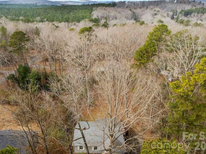 213 Woodrun Drive, Mount Gilead, NC 27306.  MLS# CAR4334949, YatesRealty ID 2158. Aerial view provides a clear overview of the lot and its position within the surrounding landscape.