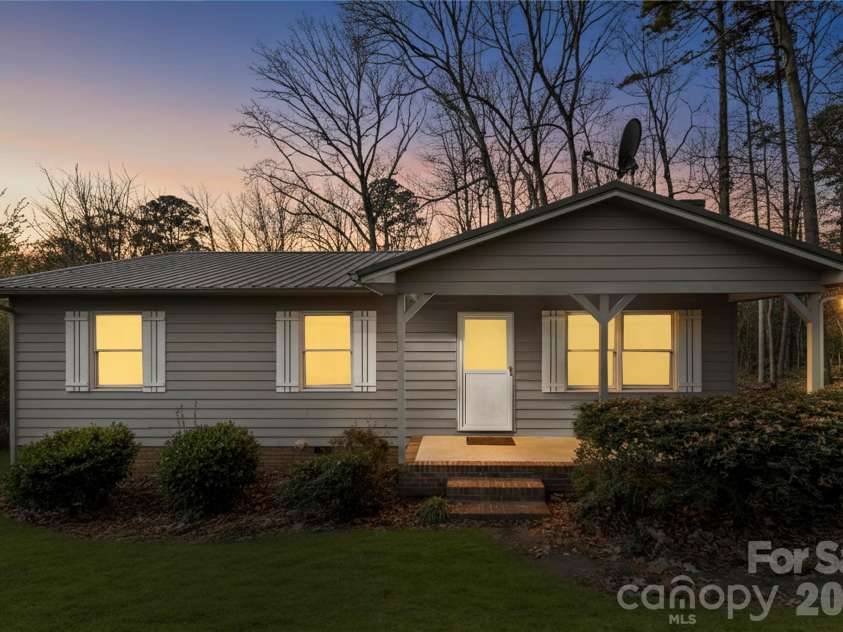 213 Woodrun Drive, Mount Gilead, NC 27306.  MLS# CAR4334949, YatesRealty ID 2158. Charming, low-maintenance exterior nestled in a peaceful lake community — perfect for easy weekends and summer living.