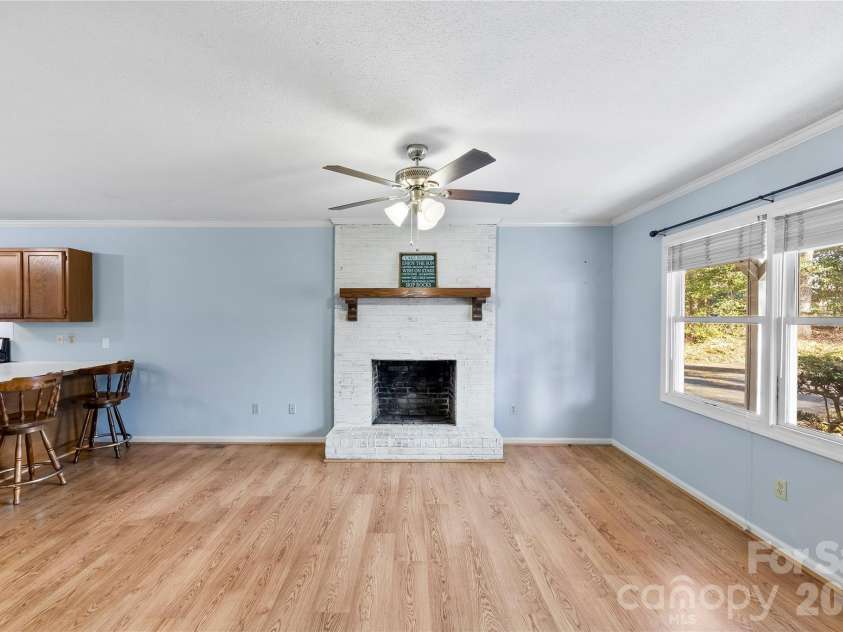 213 Woodrun Drive, Mount Gilead, NC 27306.  MLS# CAR4334949, YatesRealty ID 2158. Designed for lake living, this open living and kitchen area is perfect for coming in from the water, sharing meals, and lingering a little longer.