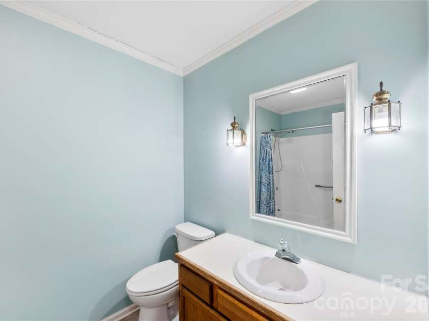 213 Woodrun Drive, Mount Gilead, NC 27306.  MLS# CAR4334949, YatesRealty ID 2158. Guest bathroom is conveniently located to serve guest bedrooms and common living areas with ease.