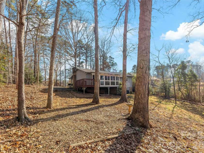 213 Woodrun Drive, Mount Gilead, NC 27306.  MLS# CAR4334949, YatesRealty ID 2158. Inviting rear exterior offers space to slow down and enjoy the natural surroundings.