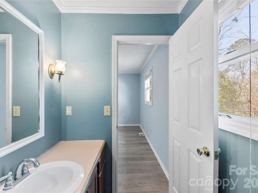 213 Woodrun Drive, Mount Gilead, NC 27306.  MLS# CAR4334949, YatesRealty ID 2158. Primary bathroom offers a private, functional space designed for easy mornings and relaxed evenings.