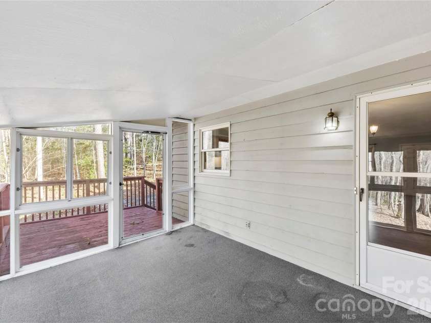 213 Woodrun Drive, Mount Gilead, NC 27306.  MLS# CAR4334949, YatesRealty ID 2158. Sunroom provides a peaceful, light-filled space to relax, recharge, and enjoy the slower pace of lake life.