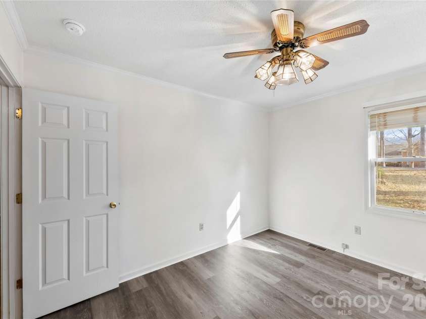 213 Woodrun Drive, Mount Gilead, NC 27306.  MLS# CAR4334949, YatesRealty ID 2158. Versatile guest bedrooms work well for weekend guests, a home office, or bonus space.