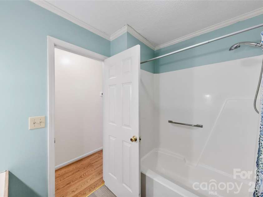 213 Woodrun Drive, Mount Gilead, NC 27306.  MLS# CAR4334949, YatesRealty ID 2158. Well-placed guest bathroom offers comfort and convenience for family and friends visiting the lake.