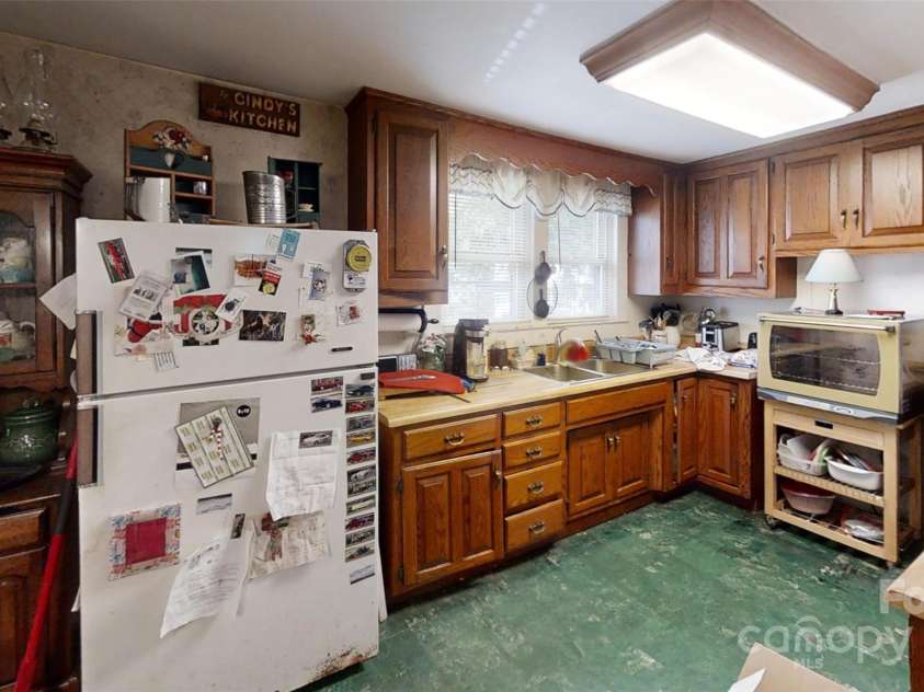 21 Maple Avenue, Candler, NC 28715.  MLS# CAR4273168, YatesRealty ID 21580. Kitchen view