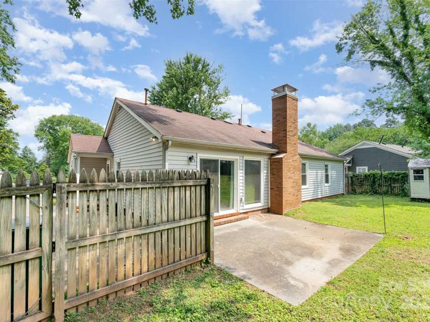 706 Hammermill Road, Charlotte, NC 28270.  MLS# CAR4267358, YatesRealty ID 21586. Back patio overlooking back yard