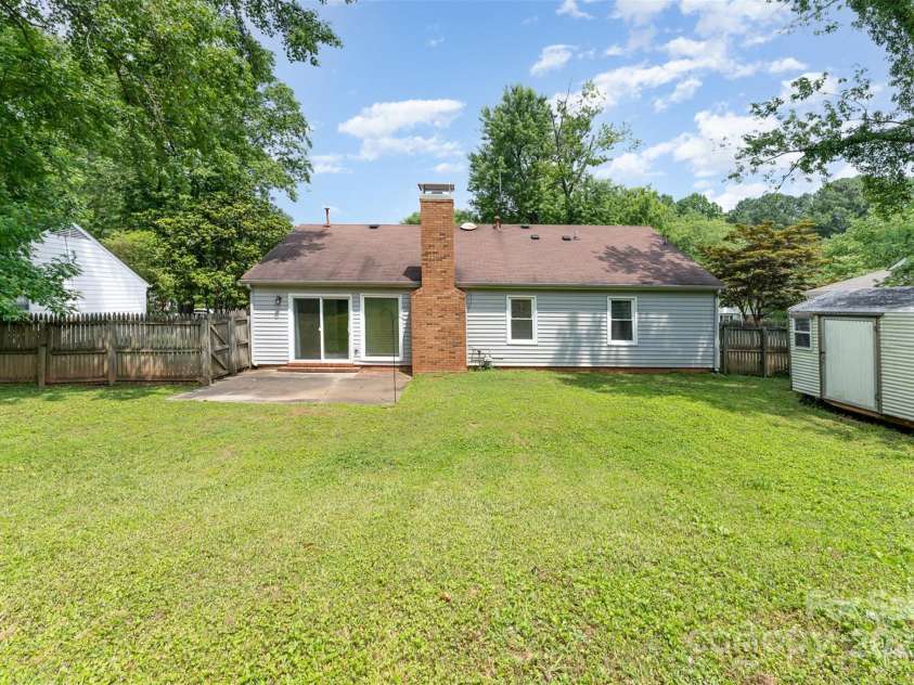 706 Hammermill Road, Charlotte, NC 28270.  MLS# CAR4267358, YatesRealty ID 21586. Expansive fenced in back yard.