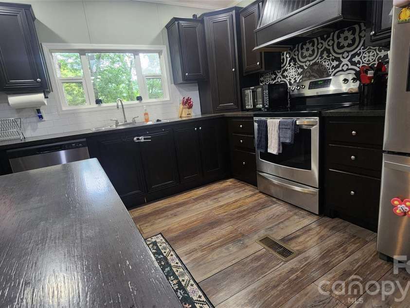 67 Indian Trail Road, Candler, NC 28715.  MLS# CAR4337508, YatesRealty ID 2159. 