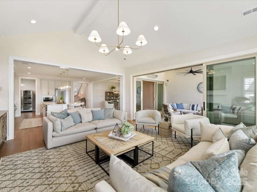 8111 Farm Crossing Lane, Huntersville, NC 28078.  MLS# CAR4189460, YatesRealty ID 2159. Great Room and Out Door Covered Living