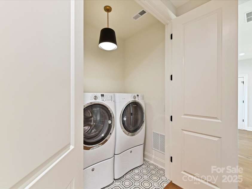 8111 Farm Crossing Lane, Huntersville, NC 28078.  MLS# CAR4189460, YatesRealty ID 2159. Upstairs Laundry Room