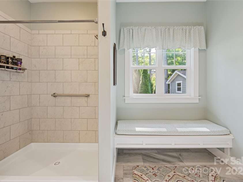 156 Olivet Lane, Fletcher, NC 28732.  MLS# CAR4272204, YatesRealty ID 21590. Beutifully tiled shower and dressing seat