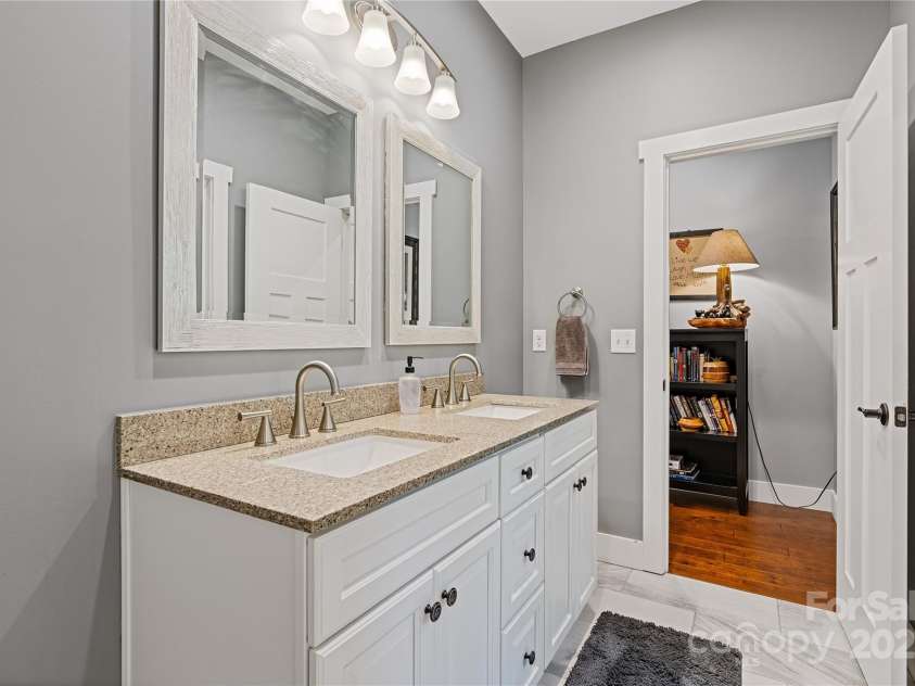 156 Olivet Lane, Fletcher, NC 28732.  MLS# CAR4272204, YatesRealty ID 21590. Guest bathroom with double sink vanity