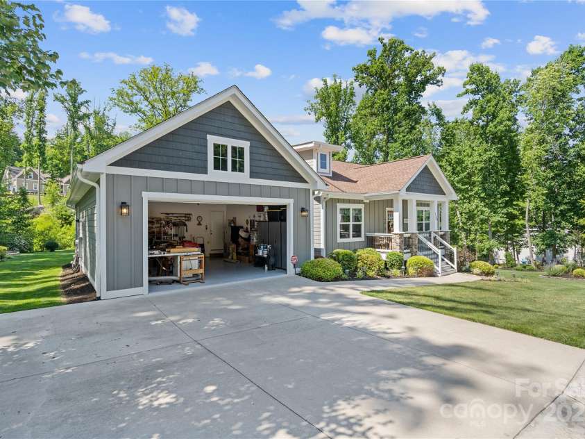 156 Olivet Lane, Fletcher, NC 28732.  MLS# CAR4272204, YatesRealty ID 21590. Spacious 2 car garage with an added driveway parking space to the side