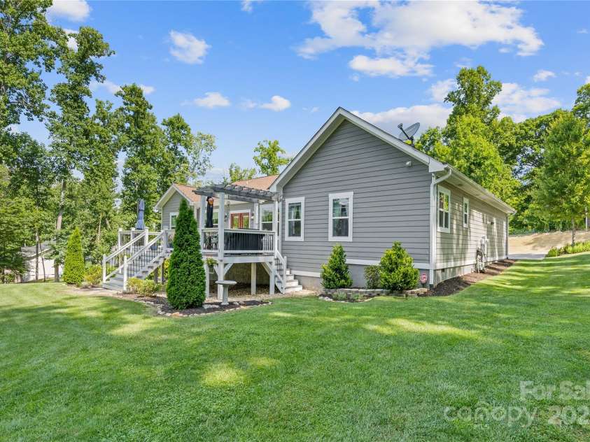 156 Olivet Lane, Fletcher, NC 28732.  MLS# CAR4272204, YatesRealty ID 21590. View of right side of home from the back yard