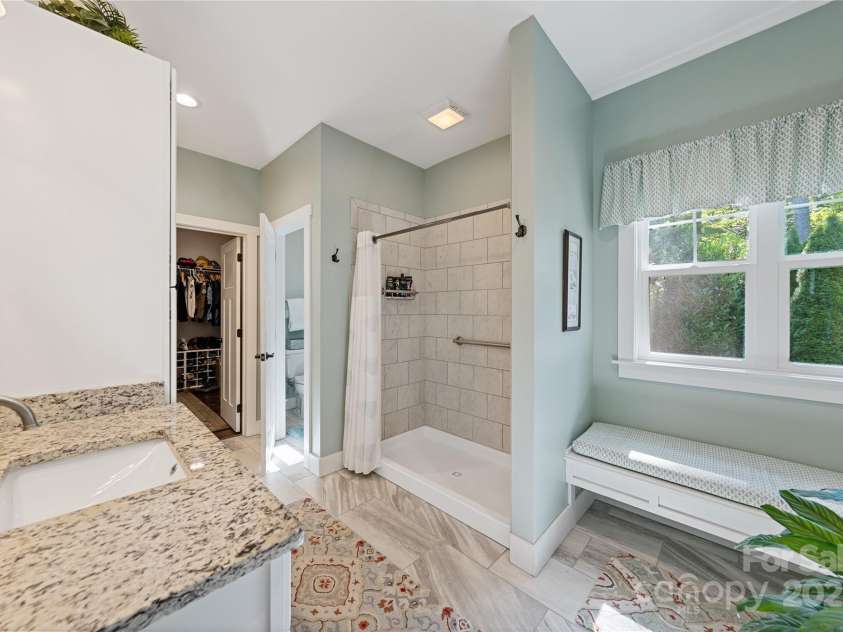 156 Olivet Lane, Fletcher, NC 28732.  MLS# CAR4272204, YatesRealty ID 21590. Walking into the primary bedroom ensuite