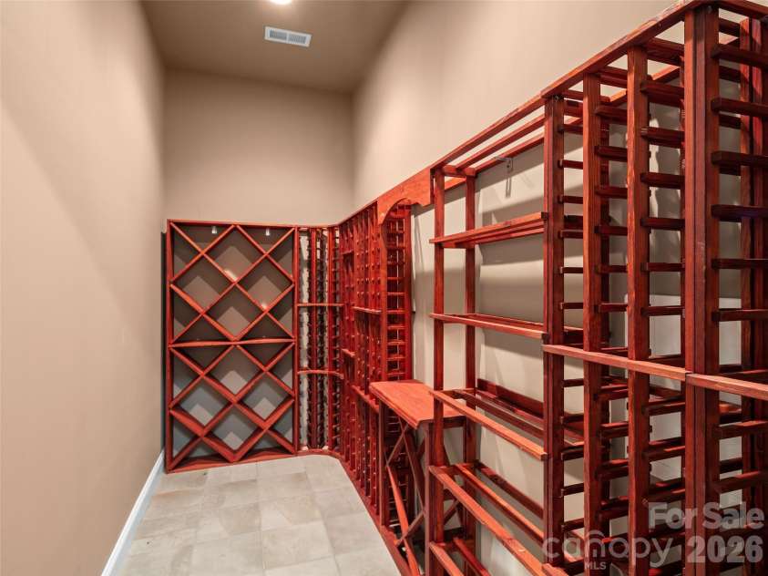 171 Walnut Valley Parkway, Arden, NC 28704.  MLS# CAR4373802, YatesRealty ID 21591. Conditioned Large-Capacity Wine Cellar on Lower Level (not shown - additional 200+/- bottle capacity wine room)