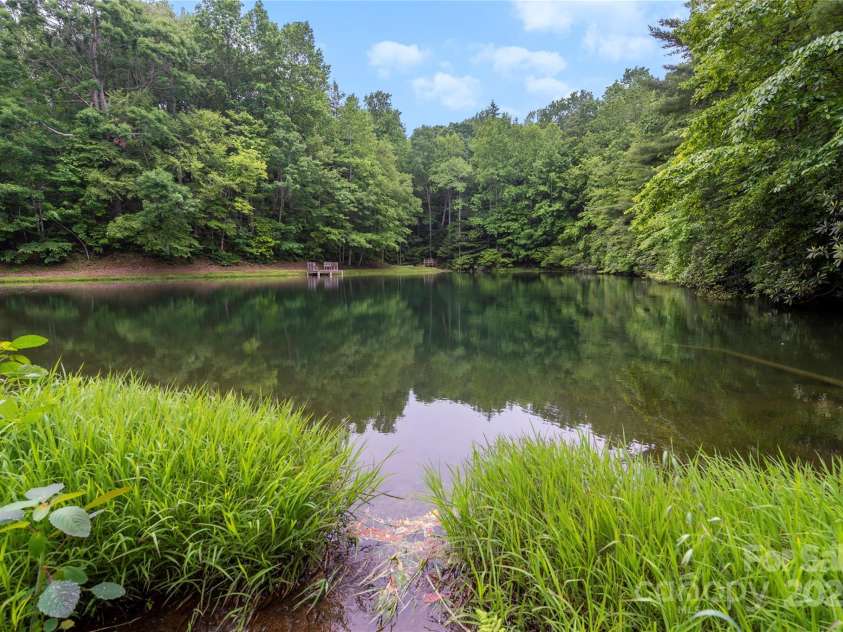 68 Huckleberry Ridge Lane, Zirconia, NC 28790.  MLS# CAR4265431, YatesRealty ID 21593. Community Pond
