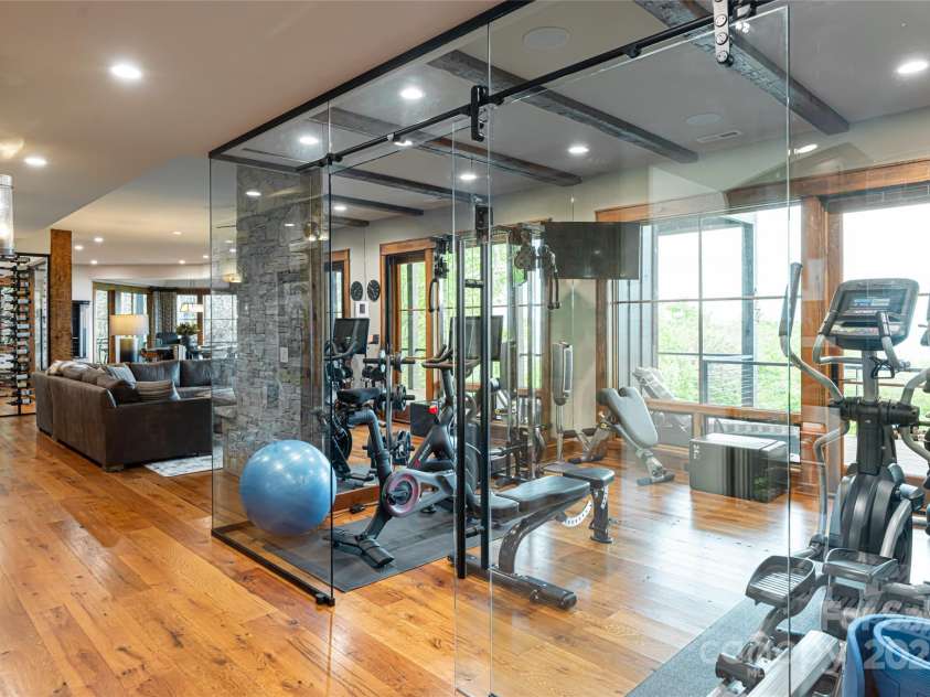 511 Asgi Trail, Maggie Valley, NC 28751.  MLS# CAR4258504, YatesRealty ID 21595. Glass, state of the art home gym