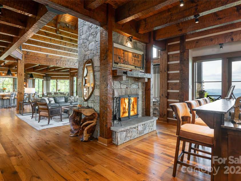 511 Asgi Trail, Maggie Valley, NC 28751.  MLS# CAR4258504, YatesRealty ID 21595. In home cocktail lounge with double sided fireplace