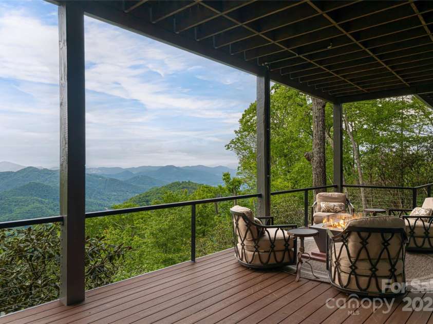 511 Asgi Trail, Maggie Valley, NC 28751.  MLS# CAR4258504, YatesRealty ID 21595. Terrace level deck with 3rd plumbed firepit