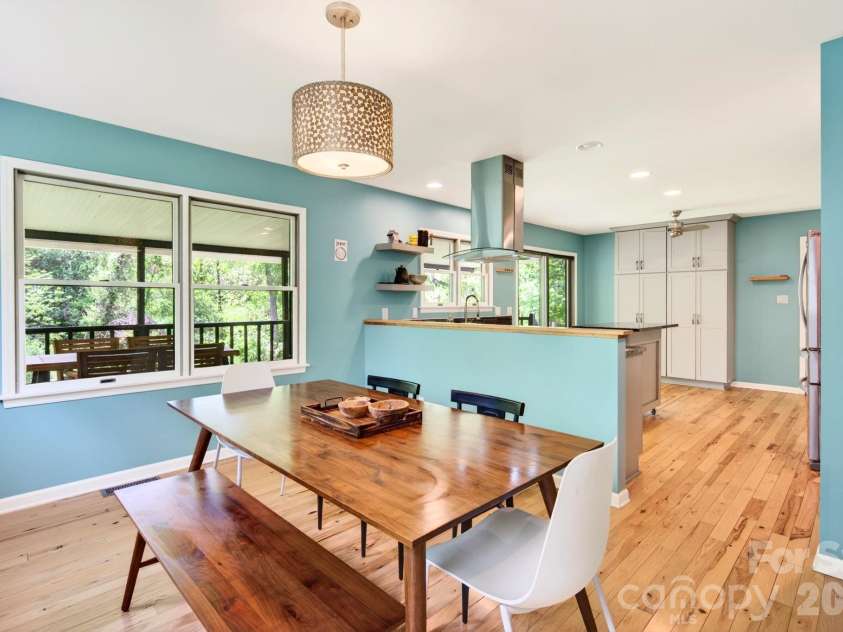 3 Crooked Creek Drive, Asheville, NC 28804.  MLS# CAR4376742, YatesRealty ID 21597. Dining area flows effortlessly into the updated kitchen