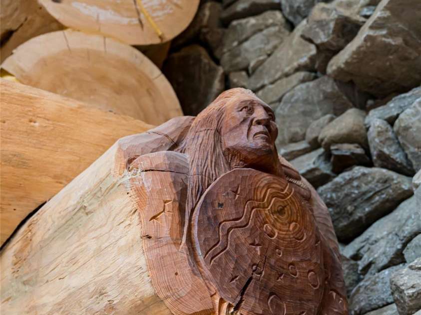 303 Flying Hawk Trail, Waynesville, NC 28786.  MLS# CAR4272138, YatesRealty ID 21603. Artist Paul Hornbuckle carved two custom pieces directly into the log onsite during construction!