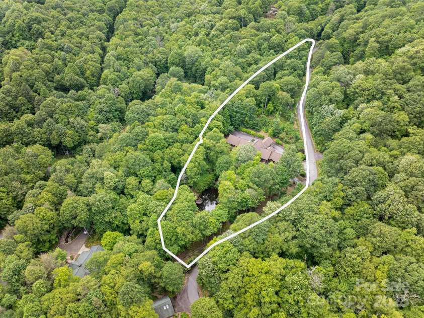 303 Flying Hawk Trail, Waynesville, NC 28786.  MLS# CAR4272138, YatesRealty ID 21603. Large gentle lot