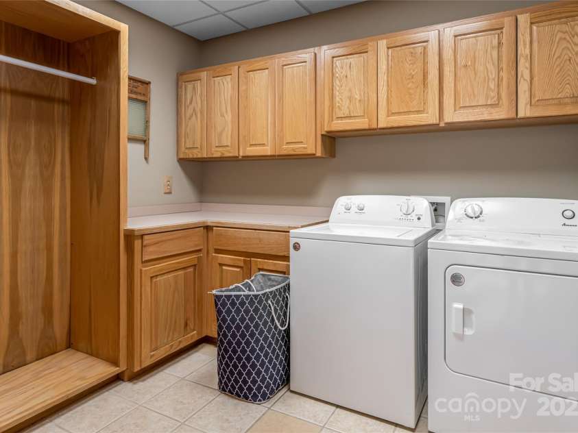 303 Flying Hawk Trail, Waynesville, NC 28786.  MLS# CAR4272138, YatesRealty ID 21603. Laundry room