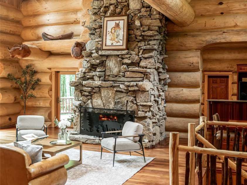 303 Flying Hawk Trail, Waynesville, NC 28786.  MLS# CAR4272138, YatesRealty ID 21603. The fireplace is breathtaking