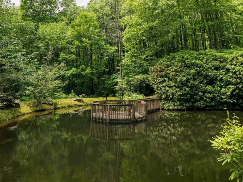 303 Flying Hawk Trail, Waynesville, NC 28786.  MLS# CAR4272138, YatesRealty ID 21603. Trout pond