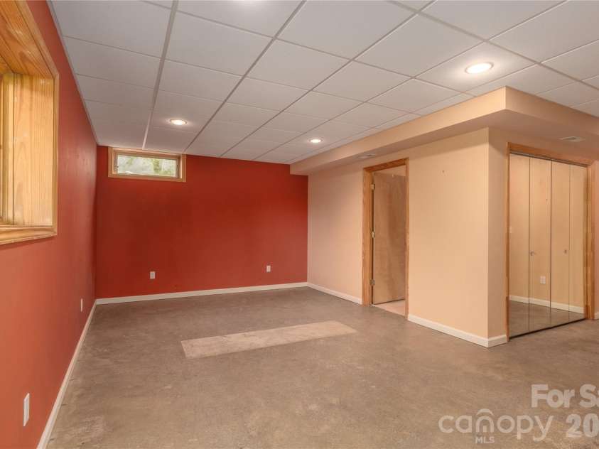 27 Magnolia Drive, Nebo, NC 28761.  MLS# CAR4367003, YatesRealty ID 21617. Lower level bedroom
