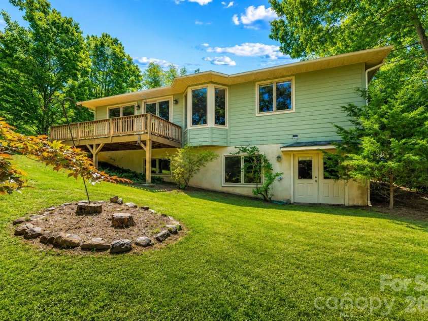 27 Magnolia Drive, Nebo, NC 28761.  MLS# CAR4367003, YatesRealty ID 21617. Rear view with enhanced grass