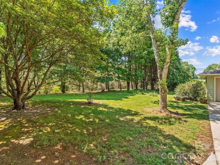 27 Magnolia Drive, Nebo, NC 28761.  MLS# CAR4367003, YatesRealty ID 21617. Side yard