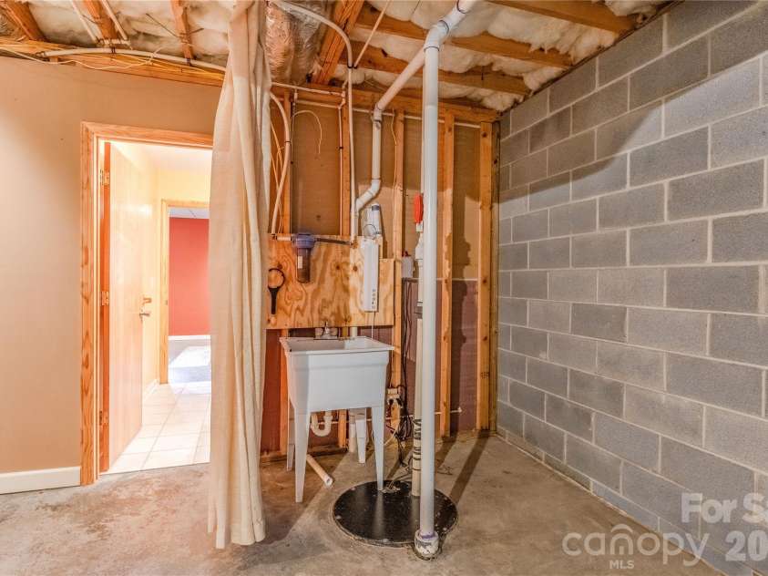 27 Magnolia Drive, Nebo, NC 28761.  MLS# CAR4367003, YatesRealty ID 21617. Utility sink in basment