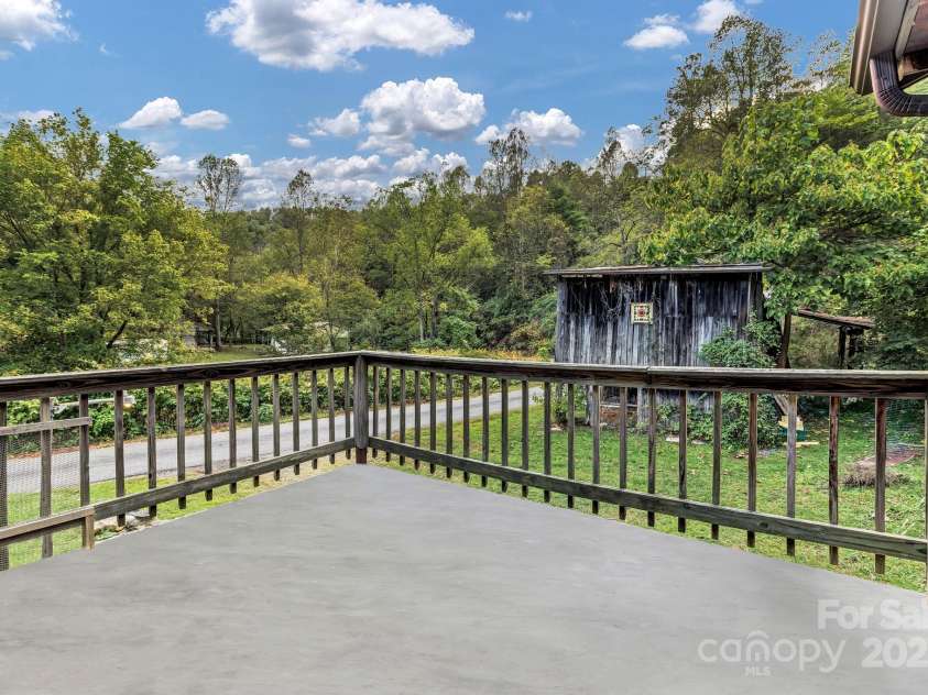 200 Dry Branch Road, Marshall, NC 28753.  MLS# CAR4308414, YatesRealty ID 2162. Patio off of Living Room.