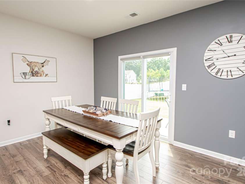 128 Hickory Ridge Drive, Locust, NC 28097.  MLS# CAR4270614, YatesRealty ID 21621. Sliding glass door that open to backyard.