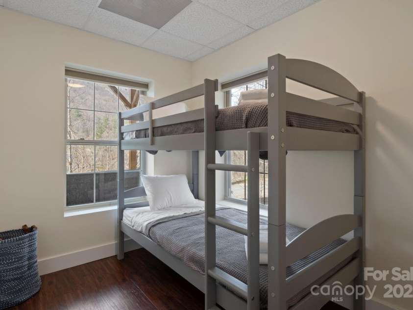 19 Frontier Court, Asheville, NC 28805.  MLS# CAR4254275, YatesRealty ID 21627. Lower Level Bunk Room