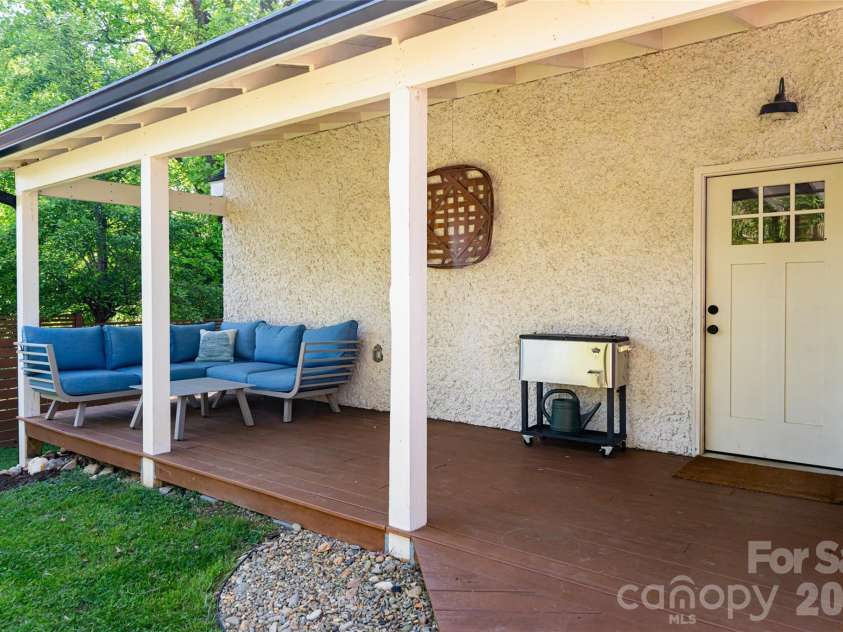 19 Neely Road, Brevard, NC 28712.  MLS# CAR4374359, YatesRealty ID 21627. Covered porch on garage