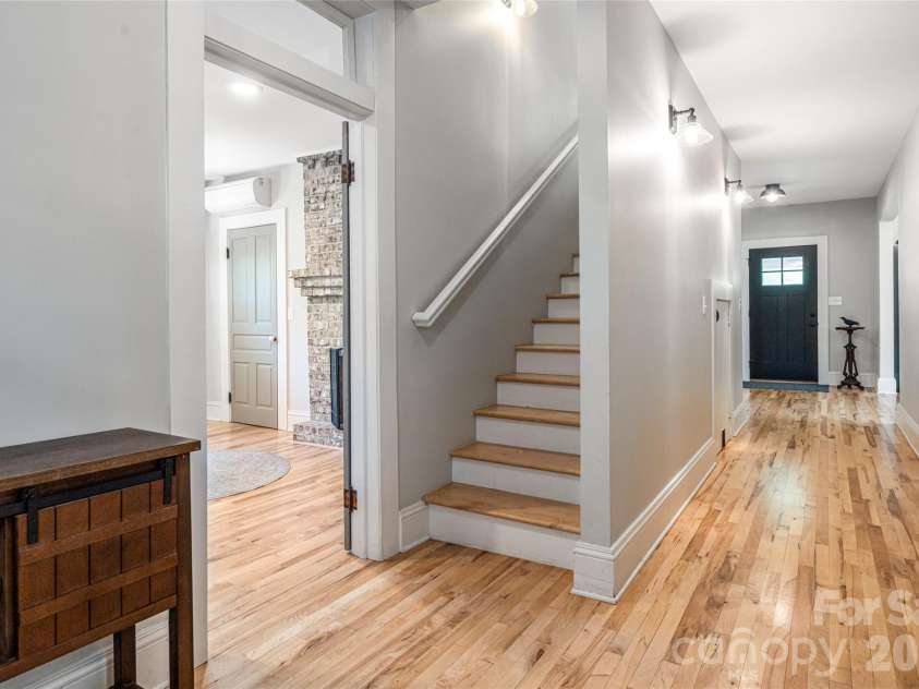 19 Neely Road, Brevard, NC 28712.  MLS# CAR4374359, YatesRealty ID 21627. Main level hallway