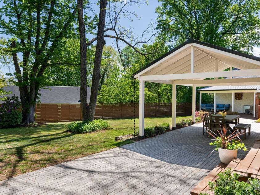 19 Neely Road, Brevard, NC 28712.  MLS# CAR4374359, YatesRealty ID 21627. Patio looking towards yard