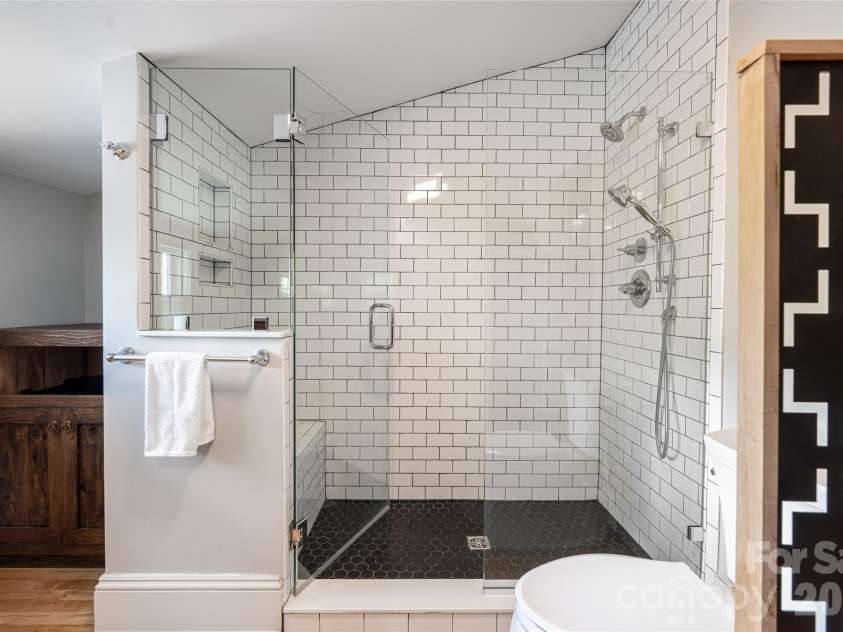 19 Neely Road, Brevard, NC 28712.  MLS# CAR4374359, YatesRealty ID 21627. Primary ensuite tile shower