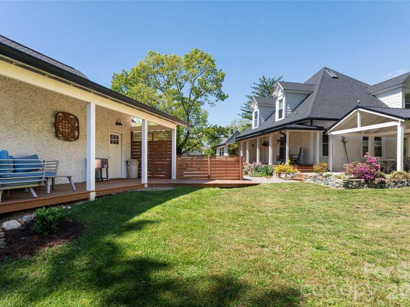 19 Neely Road, Brevard, NC 28712.  MLS# CAR4374359, YatesRealty ID 21627. Side yard