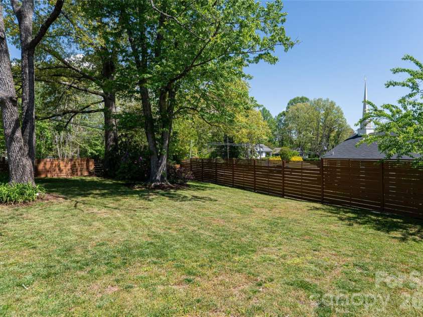 19 Neely Road, Brevard, NC 28712.  MLS# CAR4374359, YatesRealty ID 21627. Side Yard View From Patio