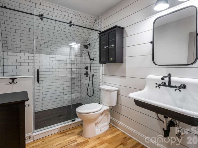 19 Neely Road, Brevard, NC 28712.  MLS# CAR4374359, YatesRealty ID 21627. Upper guest bathroom
