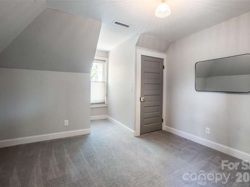 19 Neely Road, Brevard, NC 28712.  MLS# CAR4374359, YatesRealty ID 21627. Upper guest bedroom 2