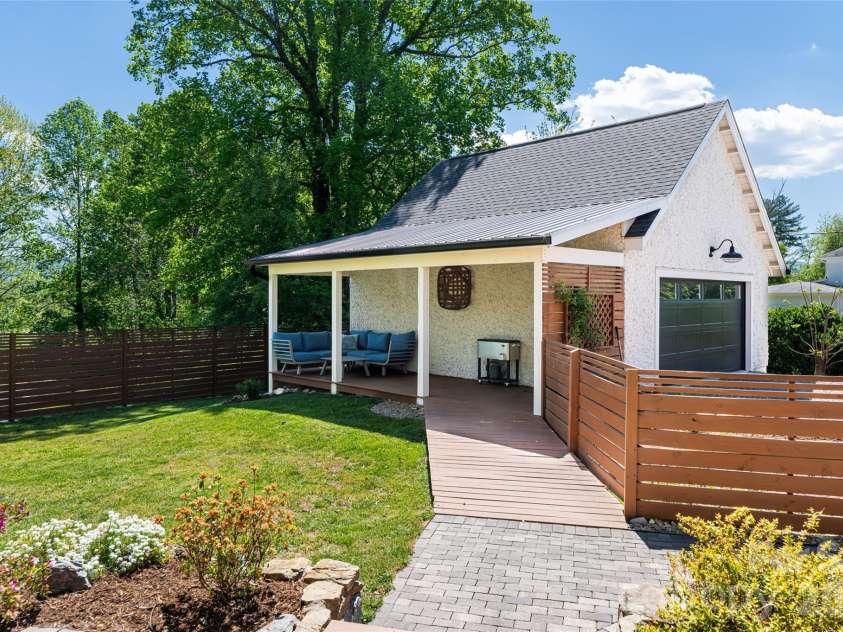 19 Neely Road, Brevard, NC 28712.  MLS# CAR4374359, YatesRealty ID 21627. Walkway to garage
