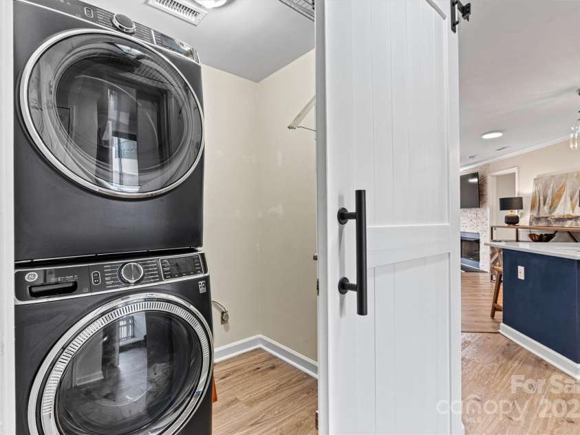 1038 Southwest Drive, Davidson, NC 28036.  MLS# CAR4268495, YatesRealty ID 21629. Laundry room with stackable washer/dryer