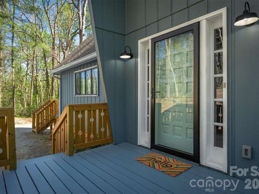 233 Bryant Ridge Drive, Swannanoa, NC 28778.  MLS# CAR4370197, YatesRealty ID 21632. Front door with side light windows. 