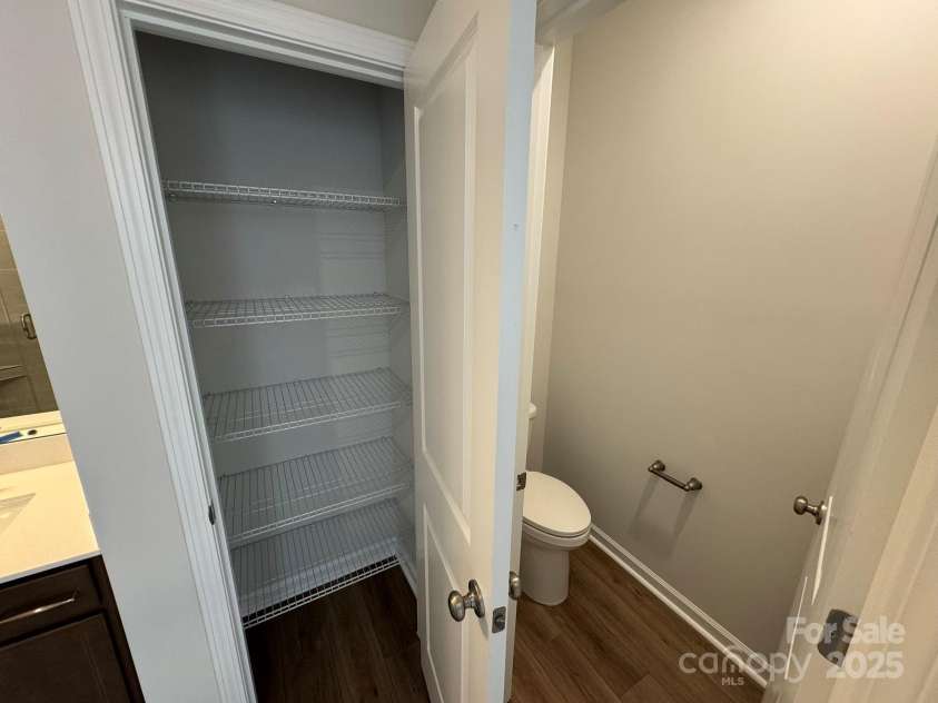4750 Lakeview Road, Charlotte, NC 28216.  MLS# CAR4261325, YatesRealty ID 2164. Primary Bath Linen closet and privacy water closet